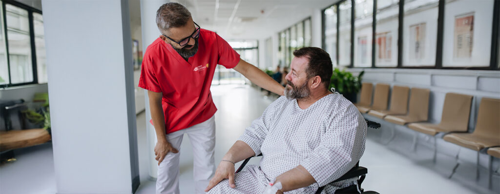 Man being cared for by a private Asian nurse at home suffering f