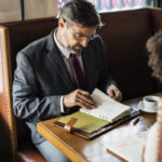 Business people discussing in the cafe