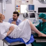 doctor-examining-pregnant-woman-delivery-while-man-holding-her-hand-1024x683