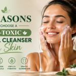 A woman with glowing skin is gently washing her face with a non-toxic facial cleanser, while holding a bottle of Velmora Glow’s Sansevieria Pure Cleanser. The background features soft, natural colors with botanical accents.