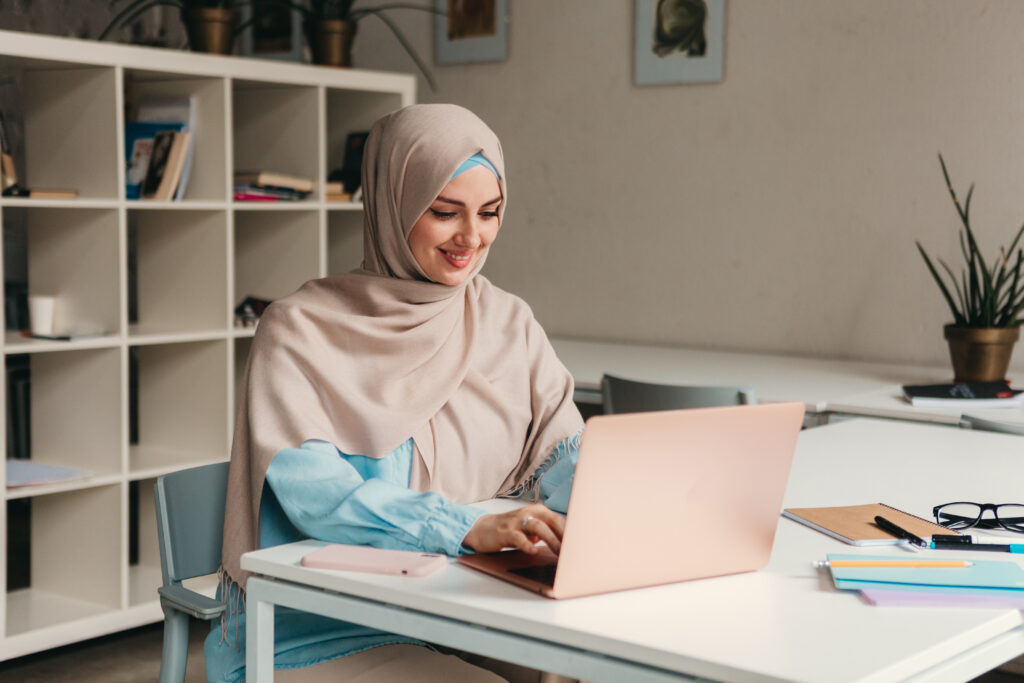 modern muslim woman in hijab in office room