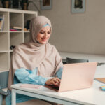 modern muslim woman in hijab in office room