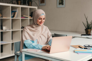 modern muslim woman in hijab in office room