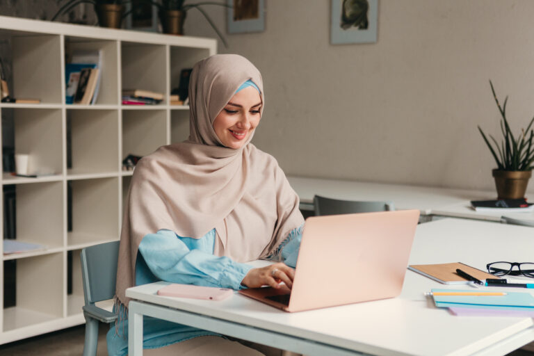 modern muslim woman in hijab in office room