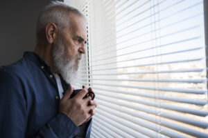 sad-elder-man-home-300x200.jpg