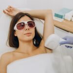 Woman receiving laser hair removal treatment for long-lasting smooth skin in New Lenox IL
