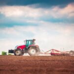 Farmer,In,Tractor,Preparing,Land,With,Seedbed,Cultivator