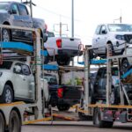 car-carrier-trailer-transport-new-car-from-manufacturing-factory-dealer-auto-vehicle-haul-truck-delivery-transport-logistics-automotive-industry-car-carrier-trailer-load-new-car-shipping_33867-1978