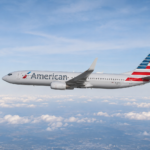 American Airlines airplane flying through a bright blue sky, representing online flight booking, affordable airfare, and convenient travel planning.